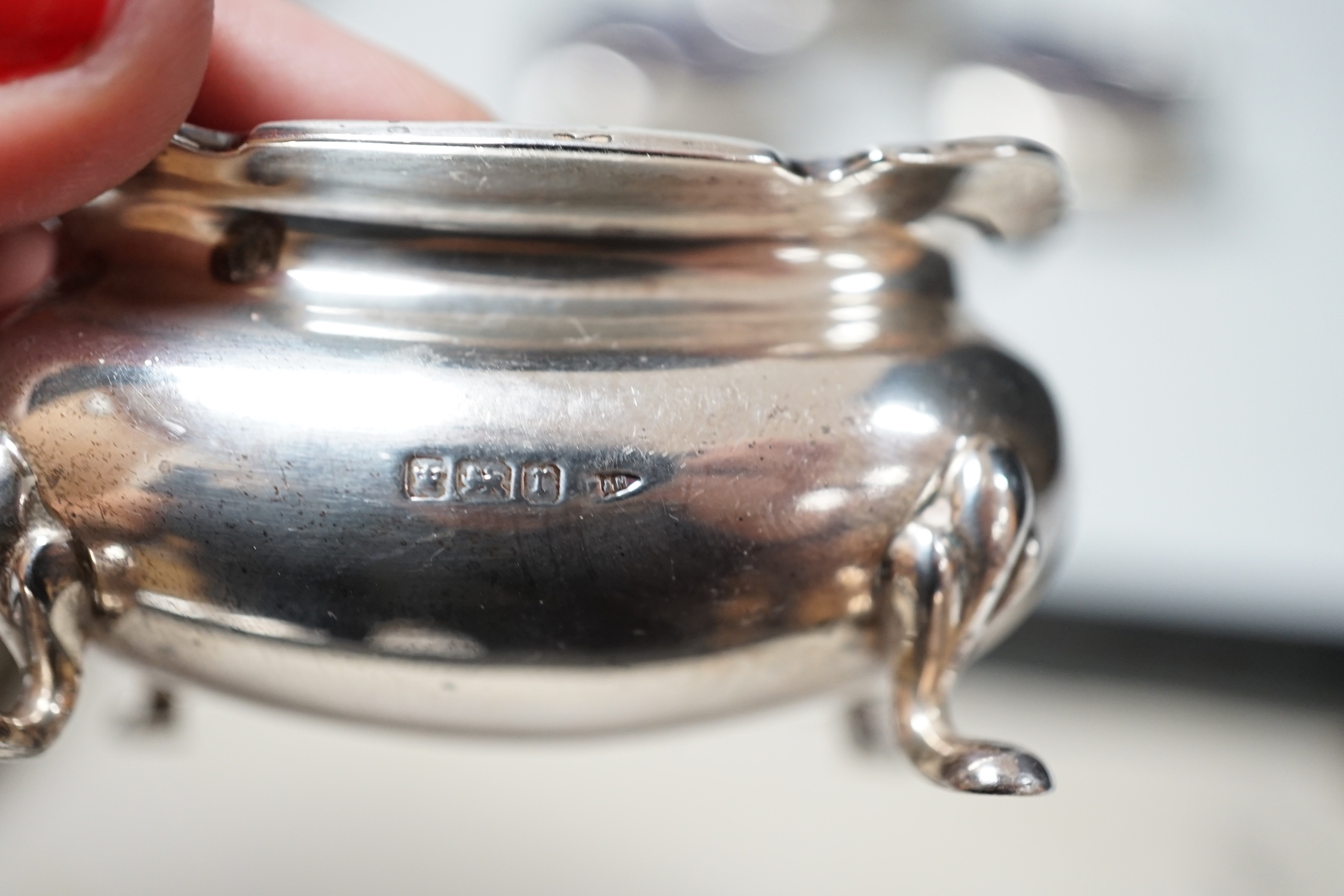 Two four piece silver cruet sets.